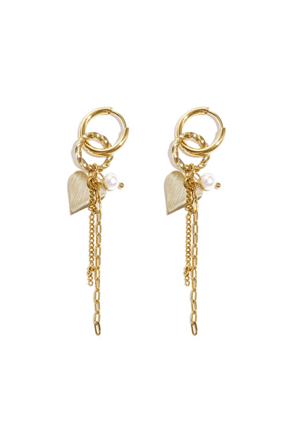 Pair of gold dangle hoop earrings with heart charms, pearls, and chain details against a white background