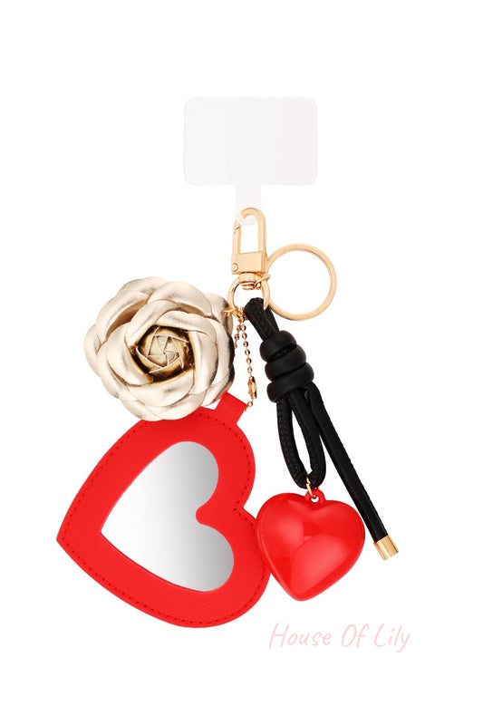Red heart-shaped mirror keychain with gold metallic rose and red glossy heart charm on gold keyring