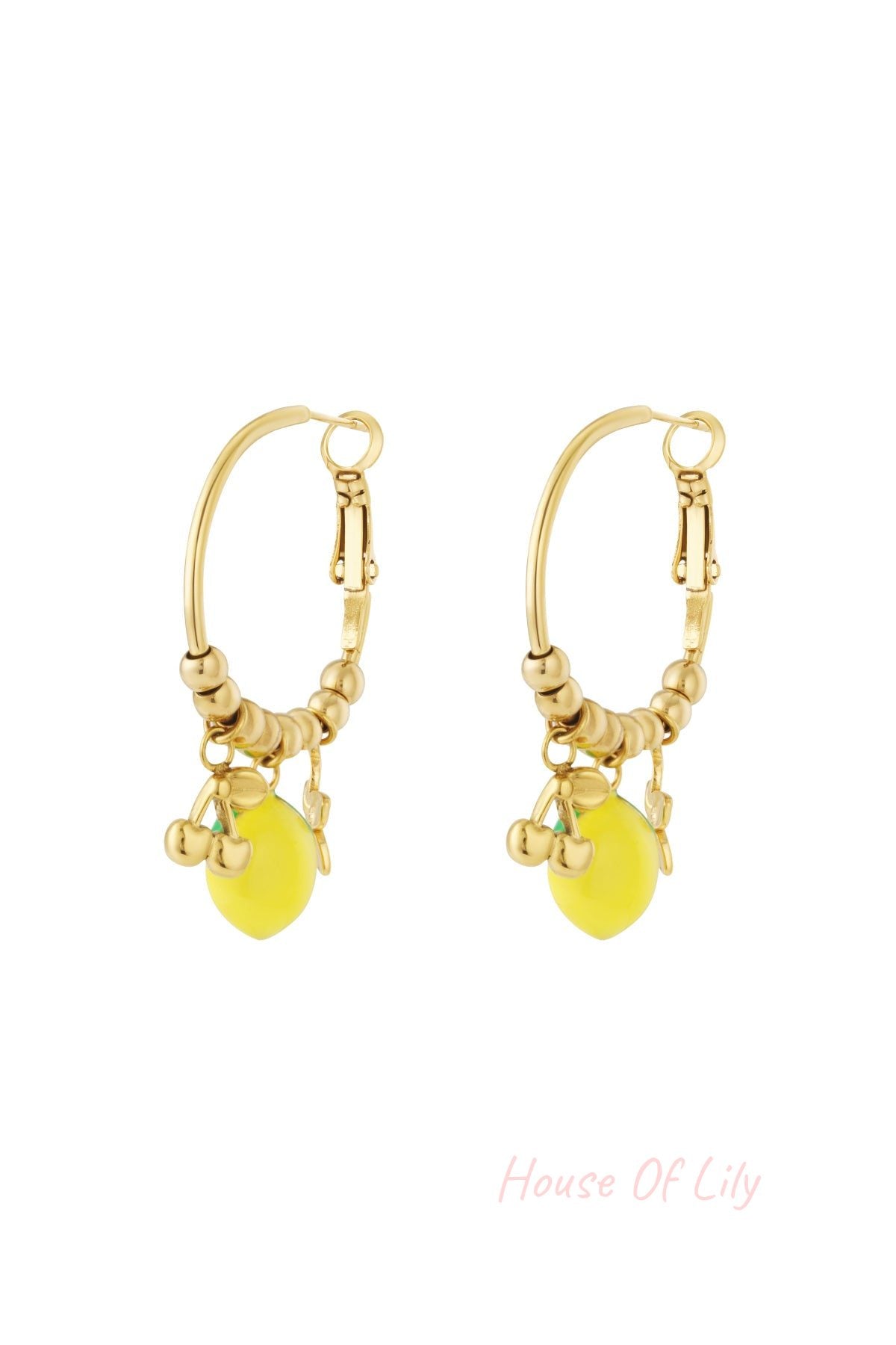 Pair of gold-tone hoop earrings adorned with beaded detail and colorful enamel fruit charms including a lemon and cherries on a white background