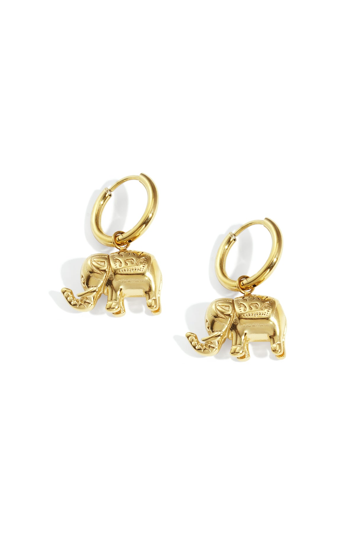 Pair of gold elephant charm hoop earrings on white background