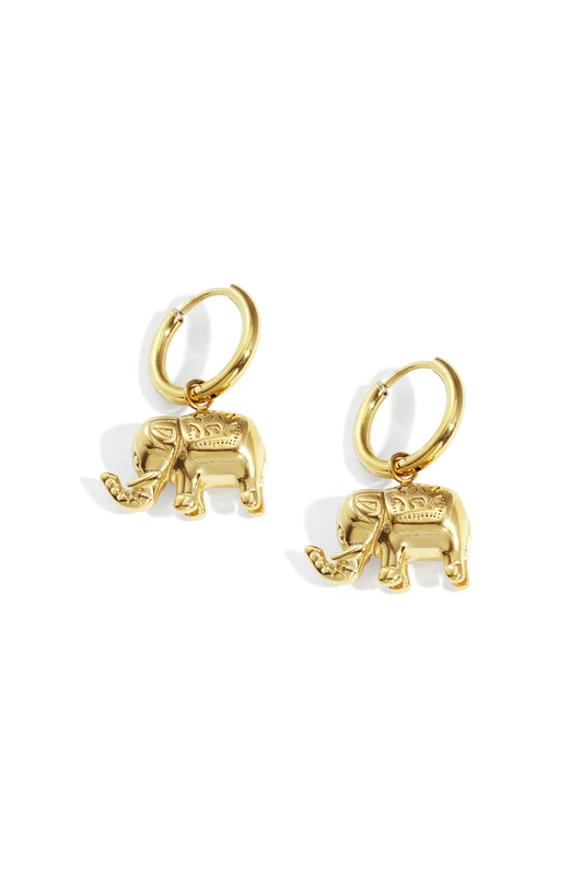 Pair of gold elephant charm hoop earrings on white background