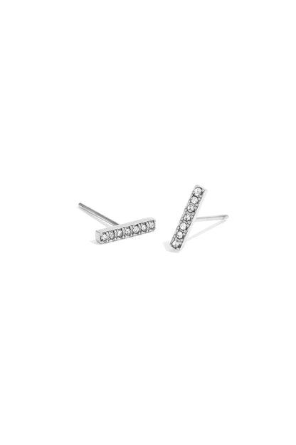 Silver-tone minimal bar stud earrings decorated with small rhinestones shown on white background