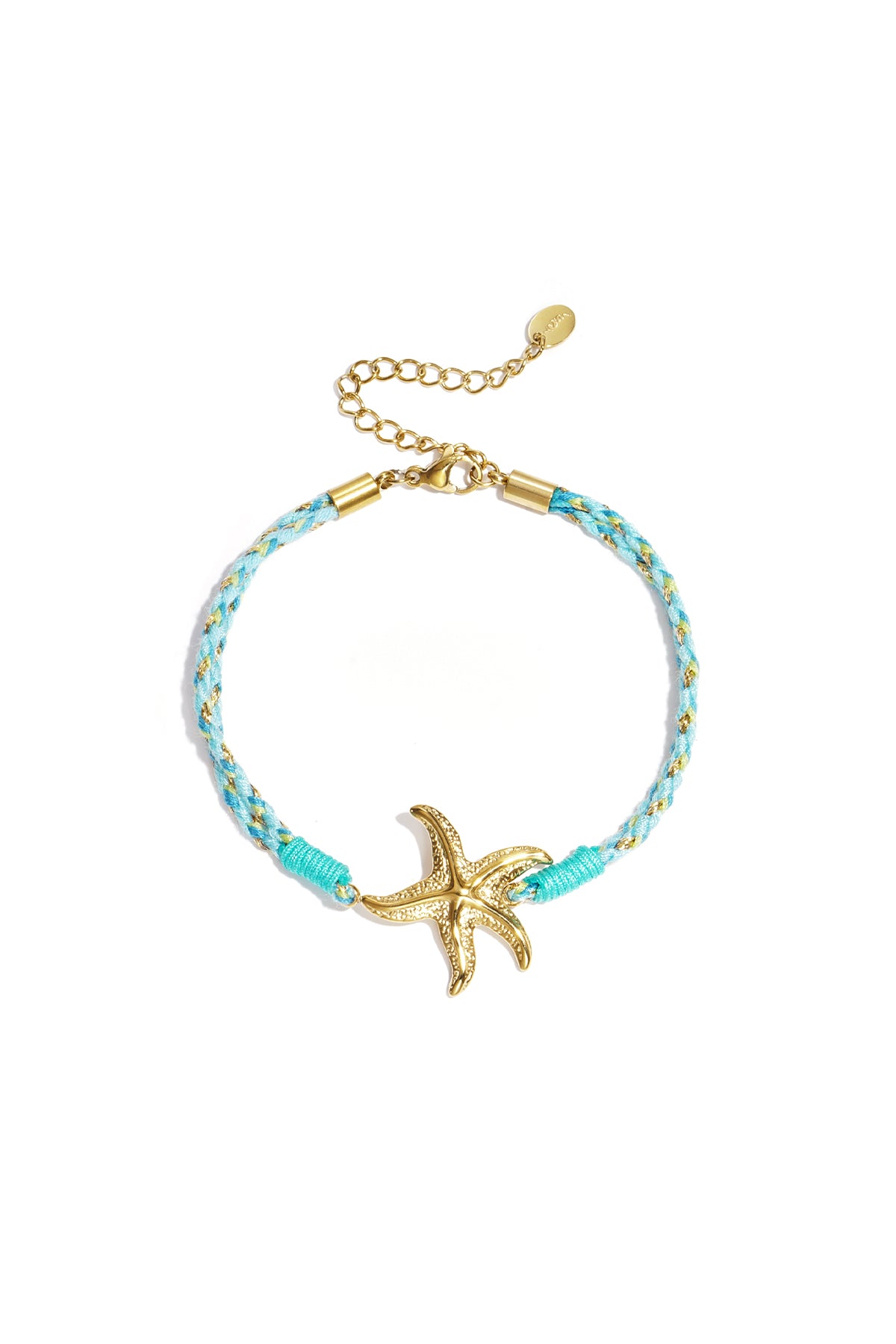 Close-up of pink and white braided rope bracelet with gold sun and moon charm on white background