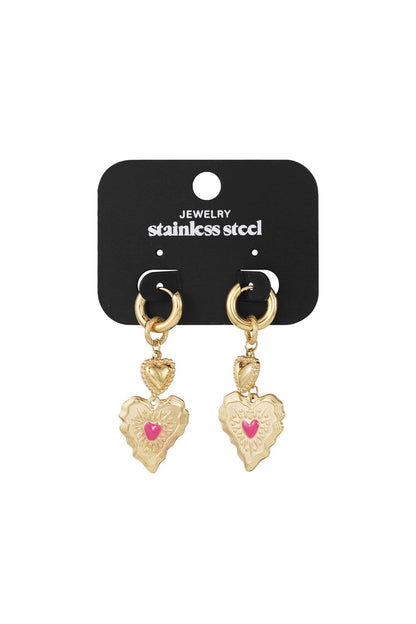 Gold stainless steel hoop earrings featuring sculpted heart charms with a small pink enamel heart inlay.