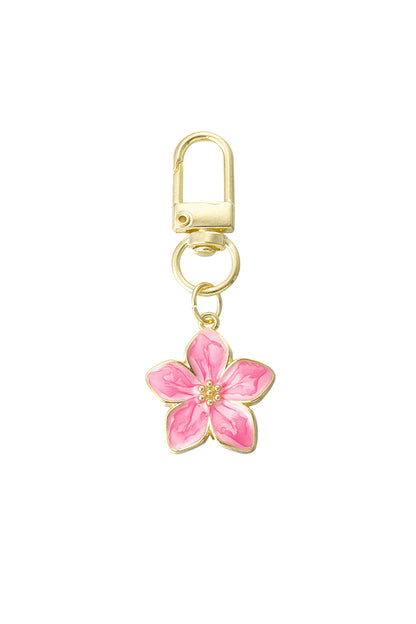 Gold alloy keyring with bright pink enamel blossom flower charm on clean white background