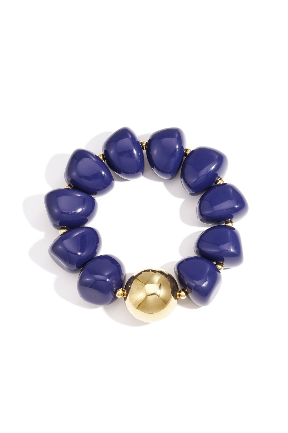 Close-up of chunky blue acrylic beaded bracelet featuring a shiny gold bead
