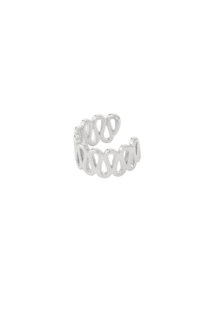 Close-up of silver swirl pattern ear cuff with open loops, isolated on white background