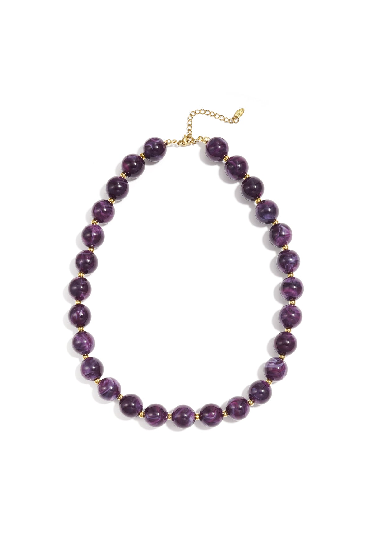 Purple marbled chunky beaded necklace with gold spacer beads and adjustable gold chain on white background