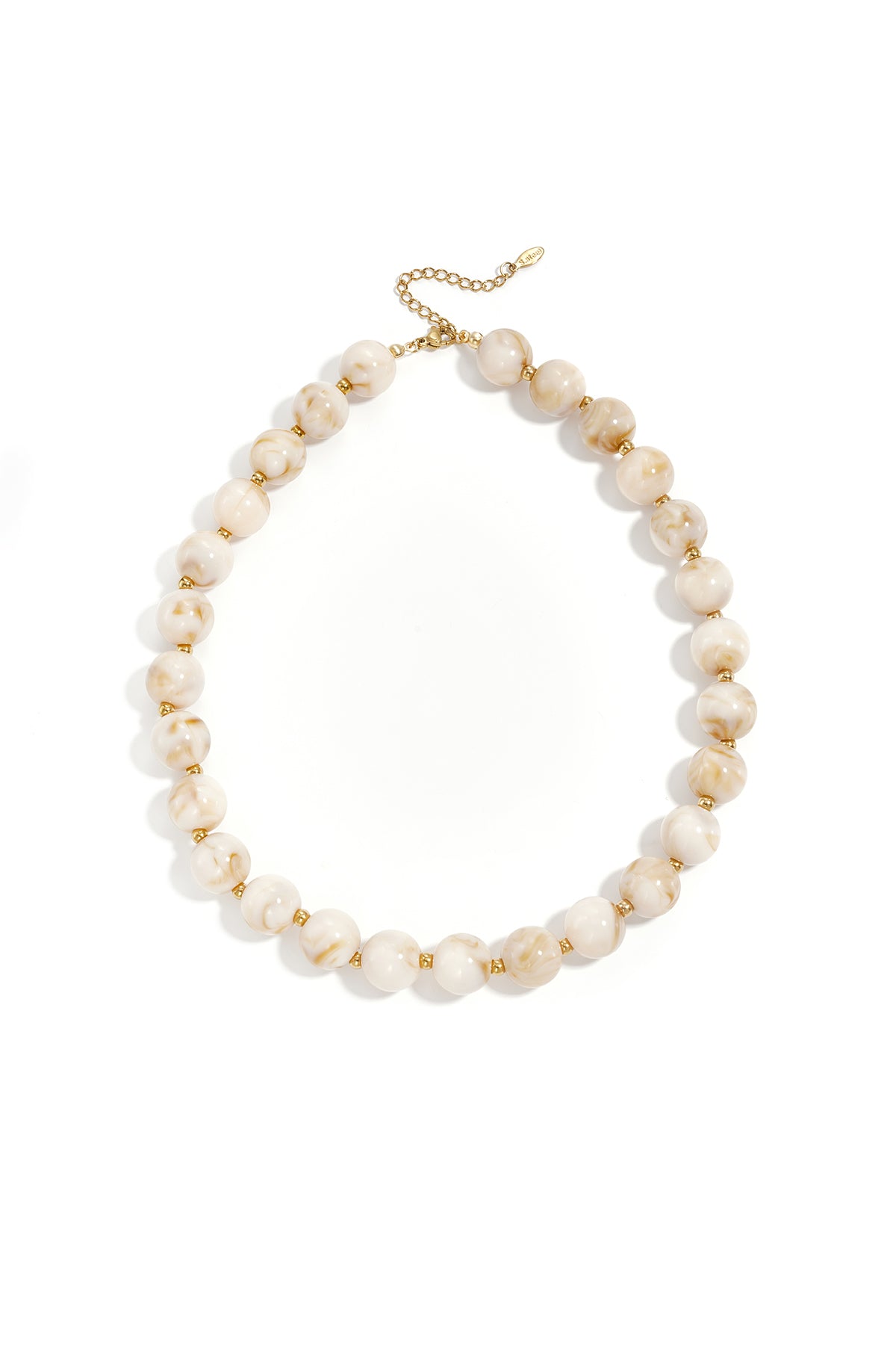 Yellow marbled chunky beaded necklace with gold spacer beads and adjustable gold chain on white background