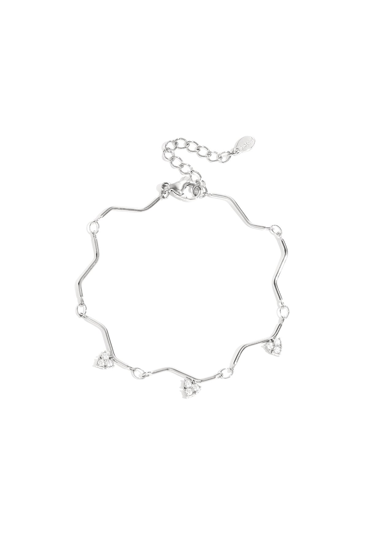 Silver zigzag charm bracelet with heart-shaped rhinestone charms displayed on white background