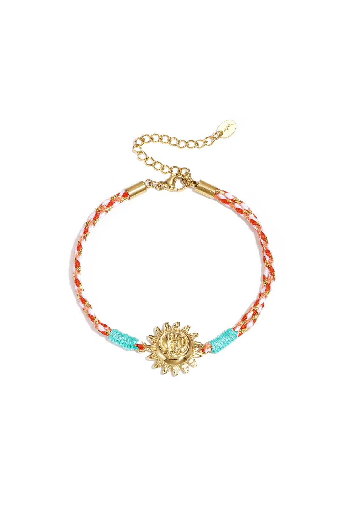Close-up of light blue braided rope bracelet with gold cowrie shell charm on white background