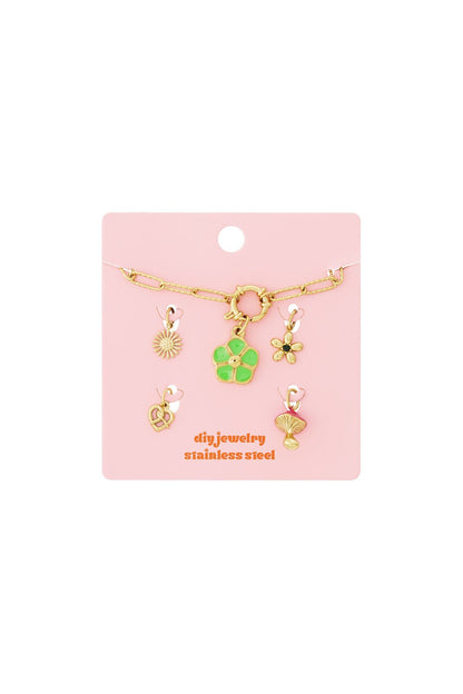 Gold-tone stainless steel DIY jewelry set with a chain and five charms: sun, green flower, small flower, pretzel, mushroom.