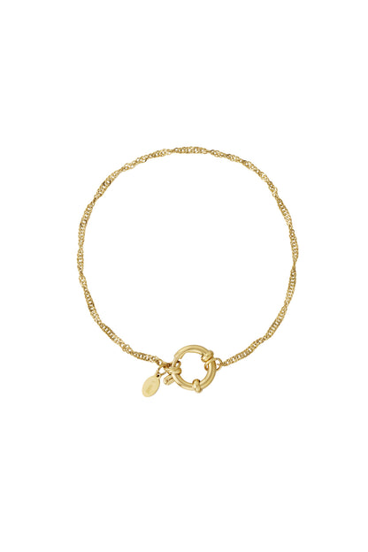 Gold twisted chain bracelet with round toggle clasp and small engraved charm on white background