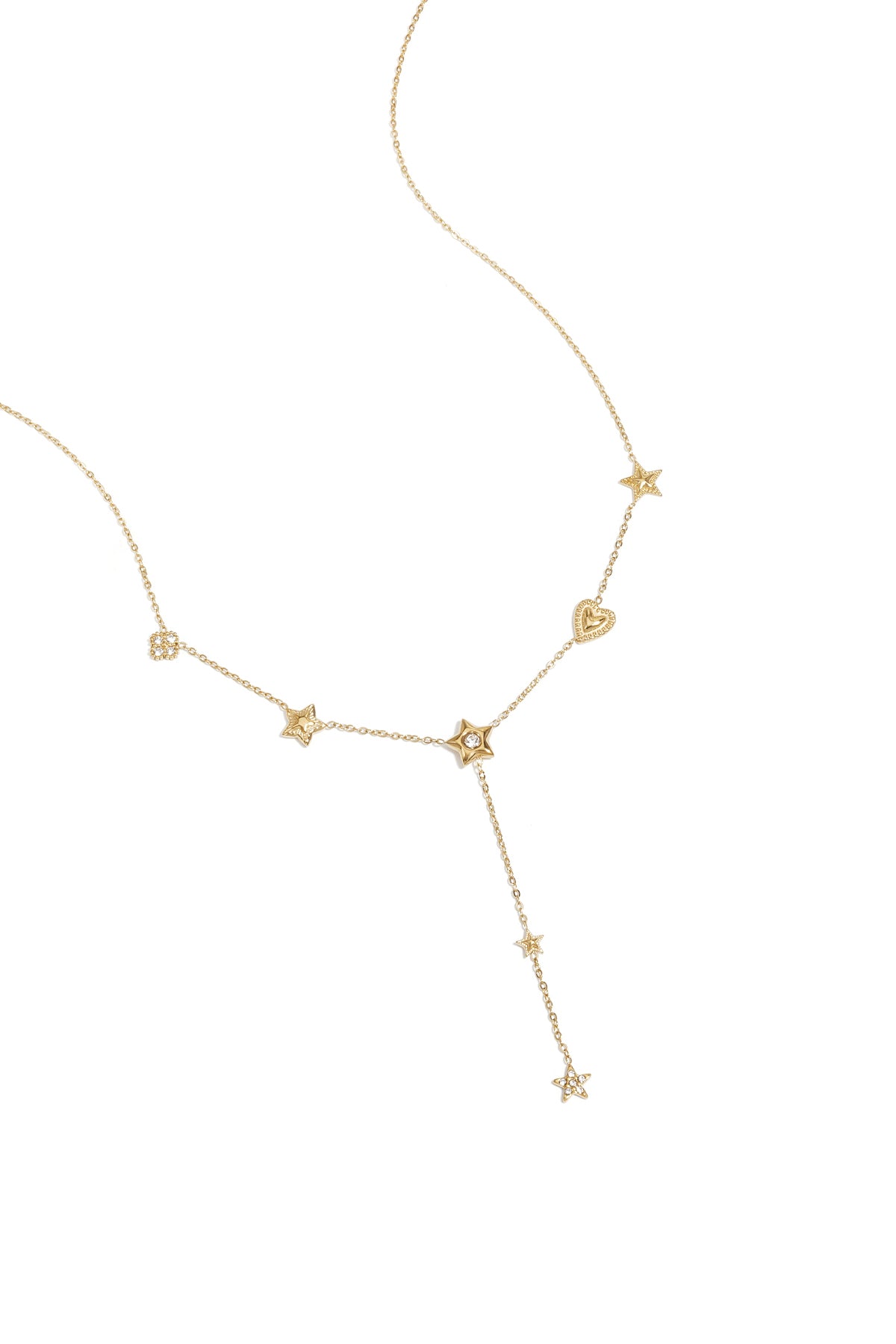 Delicate gold-tone necklace featuring multiple star and heart pendants with rhinestone accents laid on white background
