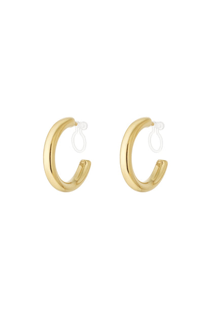 Pair of chunky gold clip-on hoop earrings with clear clip backs on white background