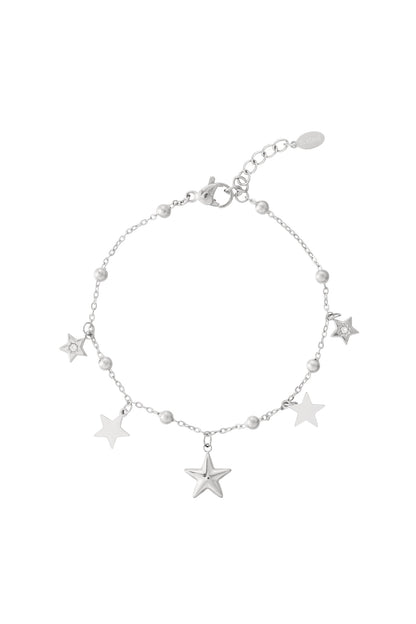 Silver star charm bracelet with star and bead charms displayed on a white background