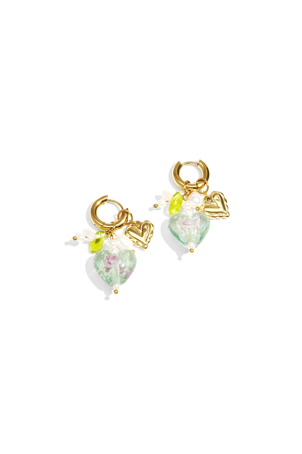 Pair of gold hoop earrings with green transparent heart charms, pearl accents, and gold mini hearts on white background