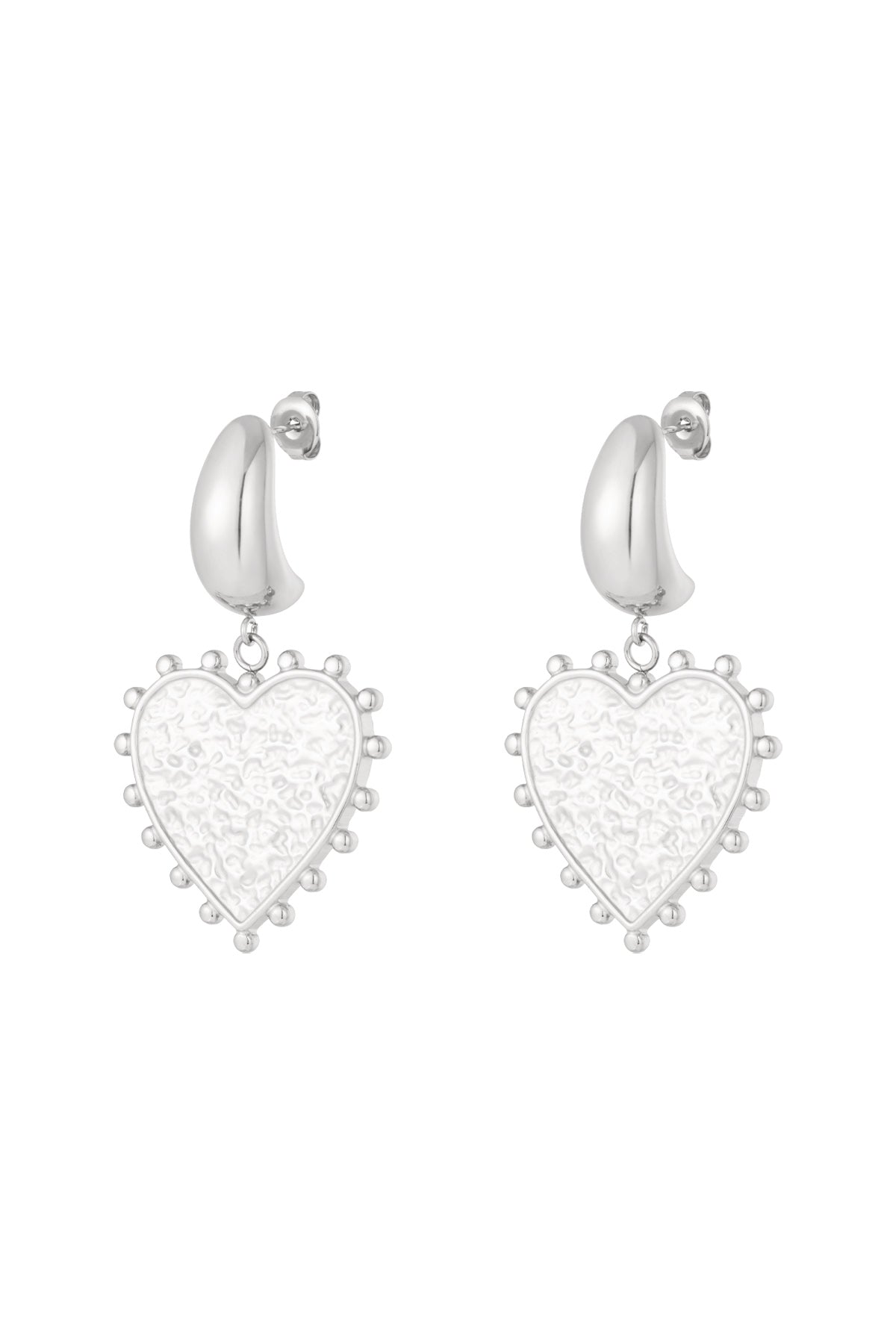 Pair of silver modern heart-shaped drop earrings with textured centers and dotted edges on white background