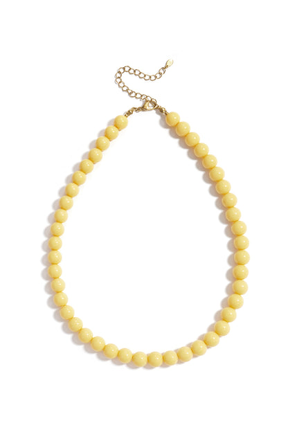 Chocolate brown resin beaded necklace with gold chain extender on white background