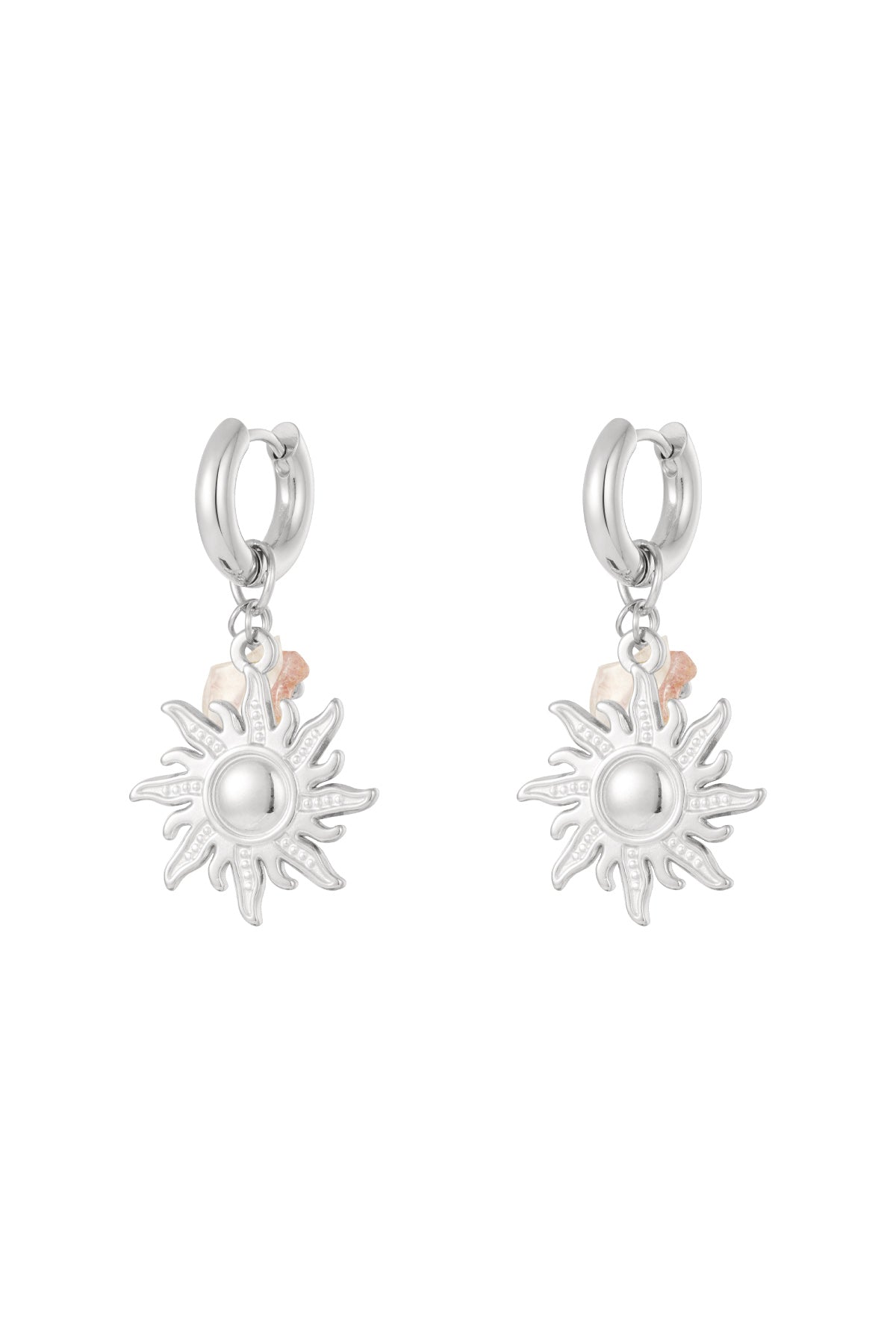 Pair of silver sun charm drop earrings with pink bead accents displayed on white background