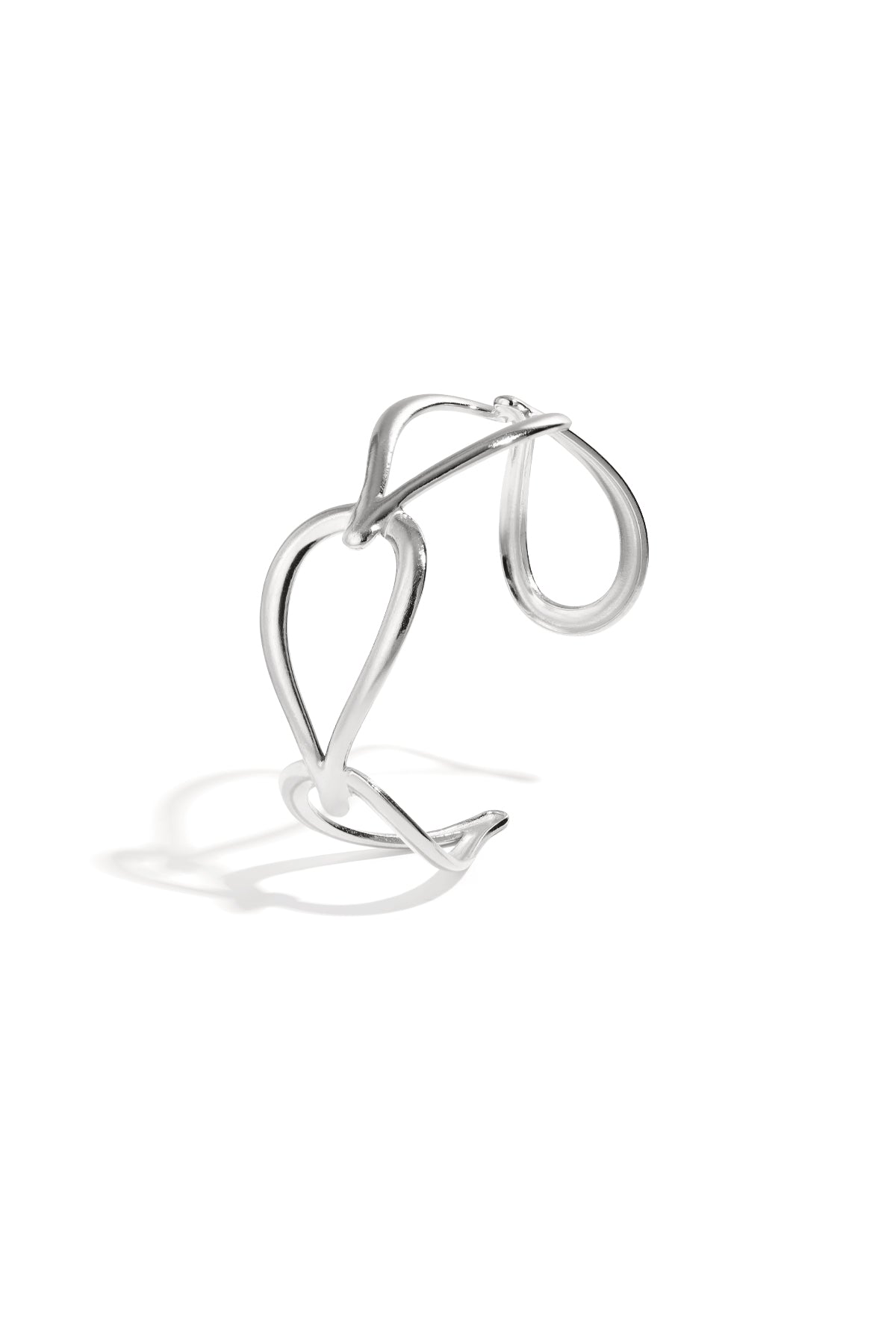 Silver sculptural open loop cuff bracelet isolated on white background