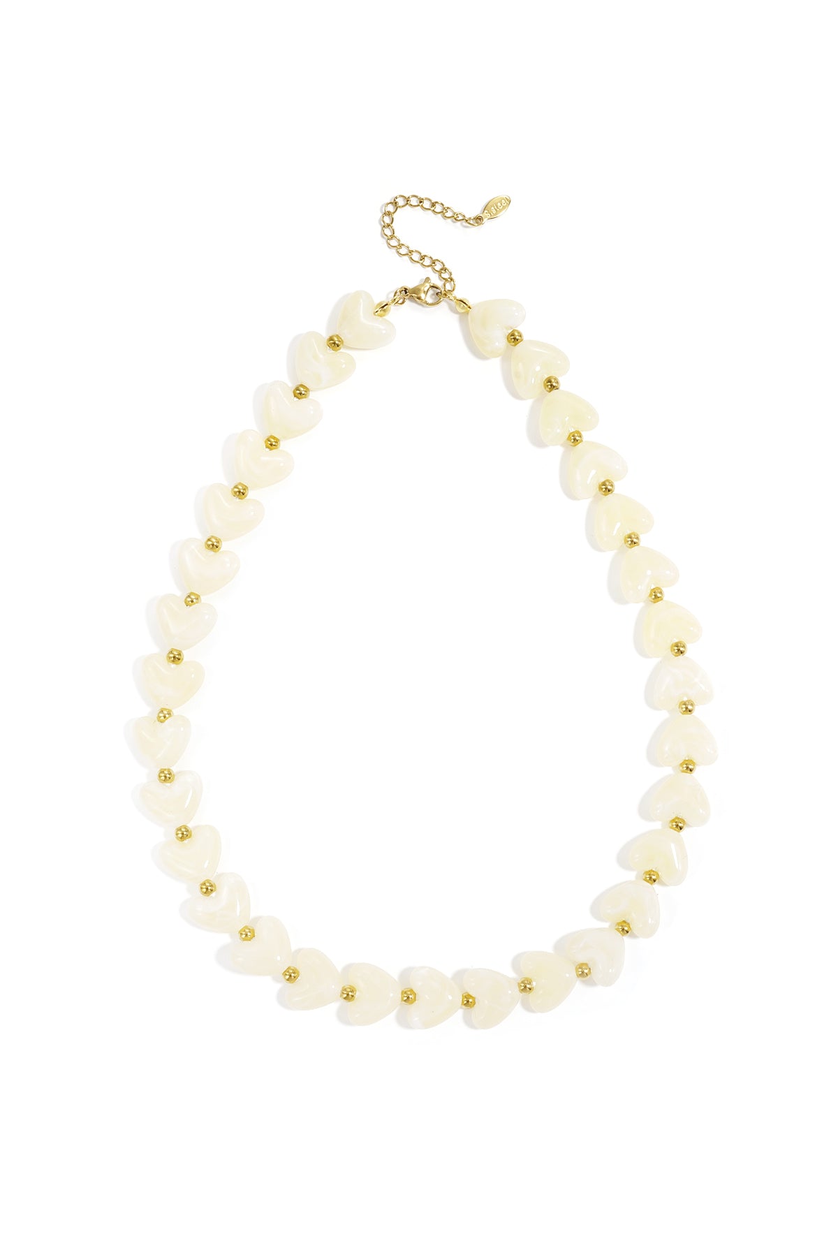 Light pink glossy heart bead necklace with gold spacers on white background