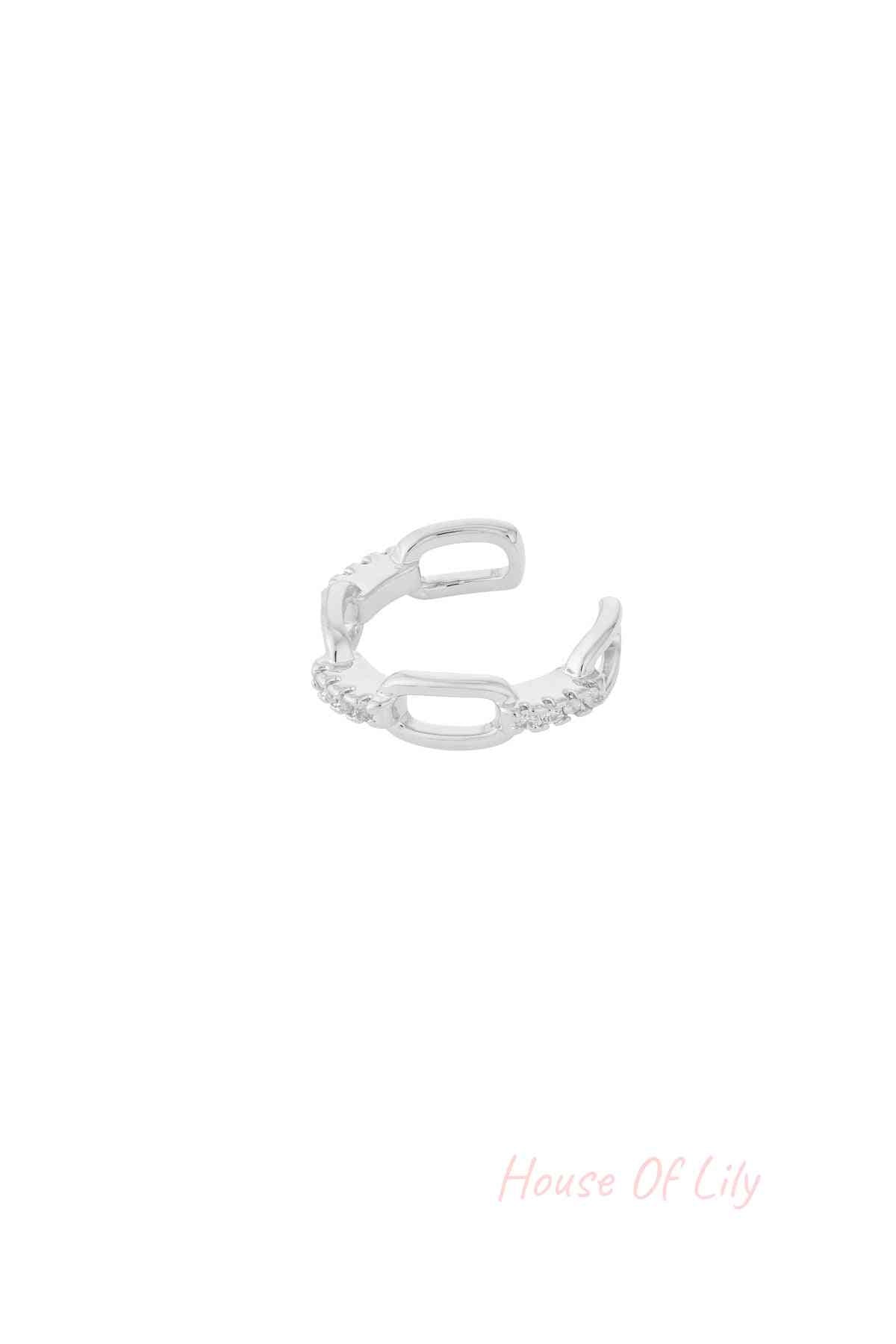 Silver chain link ear cuff with cubic zirconia on white background