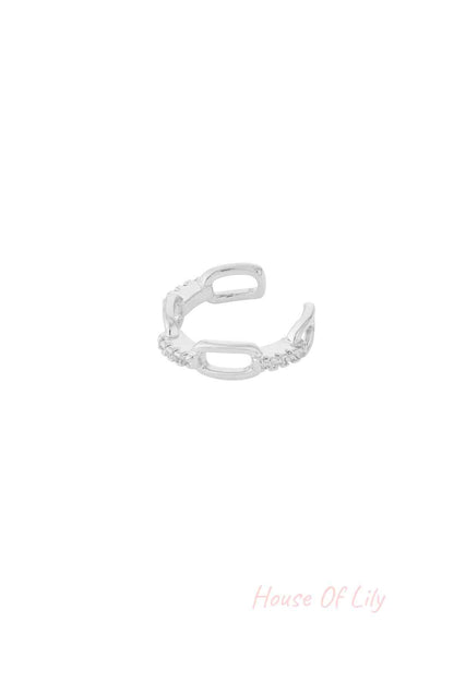 Silver chain link ear cuff with cubic zirconia on white background