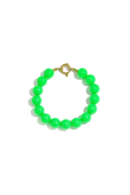 Vibrant neon green resin bead bracelet with a gold-tone circular clasp, centered on a white background.