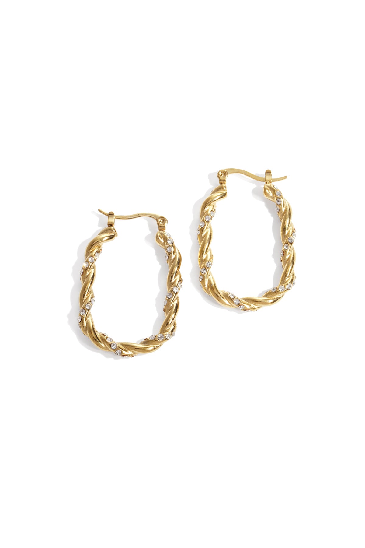 Close-up of gold twisted hoop earrings adorned with rhinestones on white background