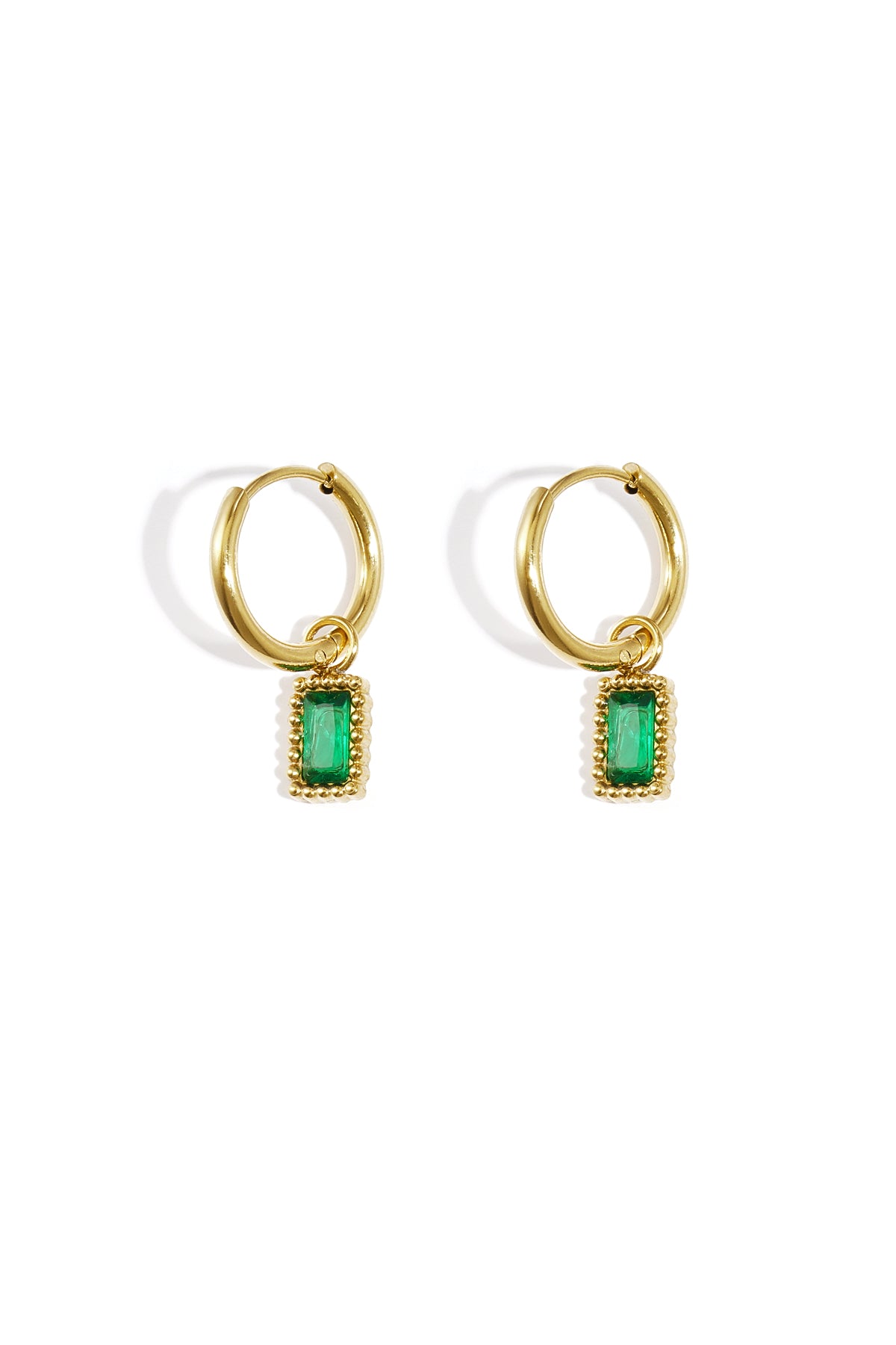 Pair of gold hoop earrings with green rectangular gemstone charms on a white background