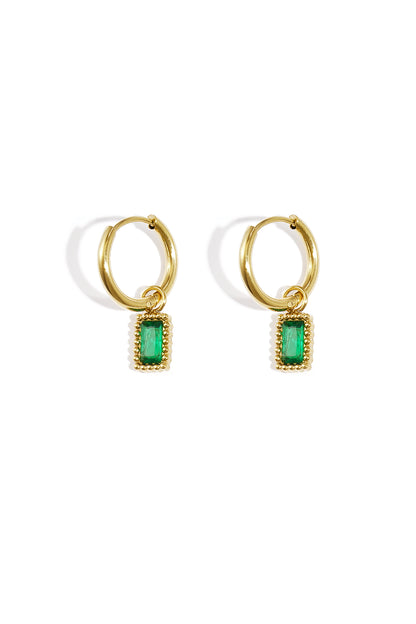 Pair of gold hoop earrings with green rectangular gemstone charms on a white background