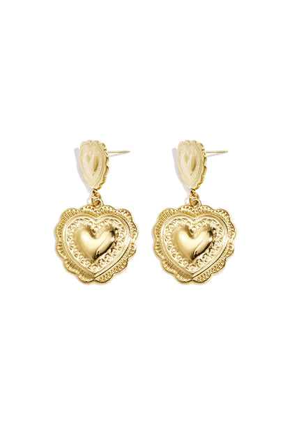 Pair of gold-tone double heart drop earrings with textured design isolated on white background