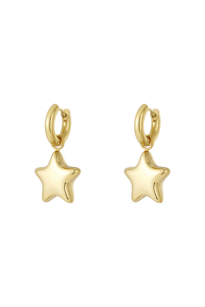 Pair of polished gold star-shaped drop earrings with smooth hoops on white background