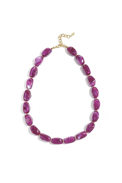 Amber chunky acrylic beaded necklace with marbled finish and gold chain extender on white background