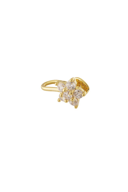 Close-up of a gold-toned floral ear cuff with six clear crystals arranged in a flower pattern on a white background