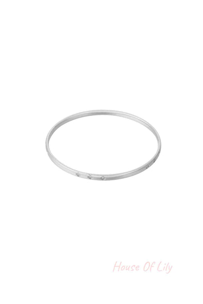 Silver mini diamond bangle with subtle rhinestone accents shown on white background