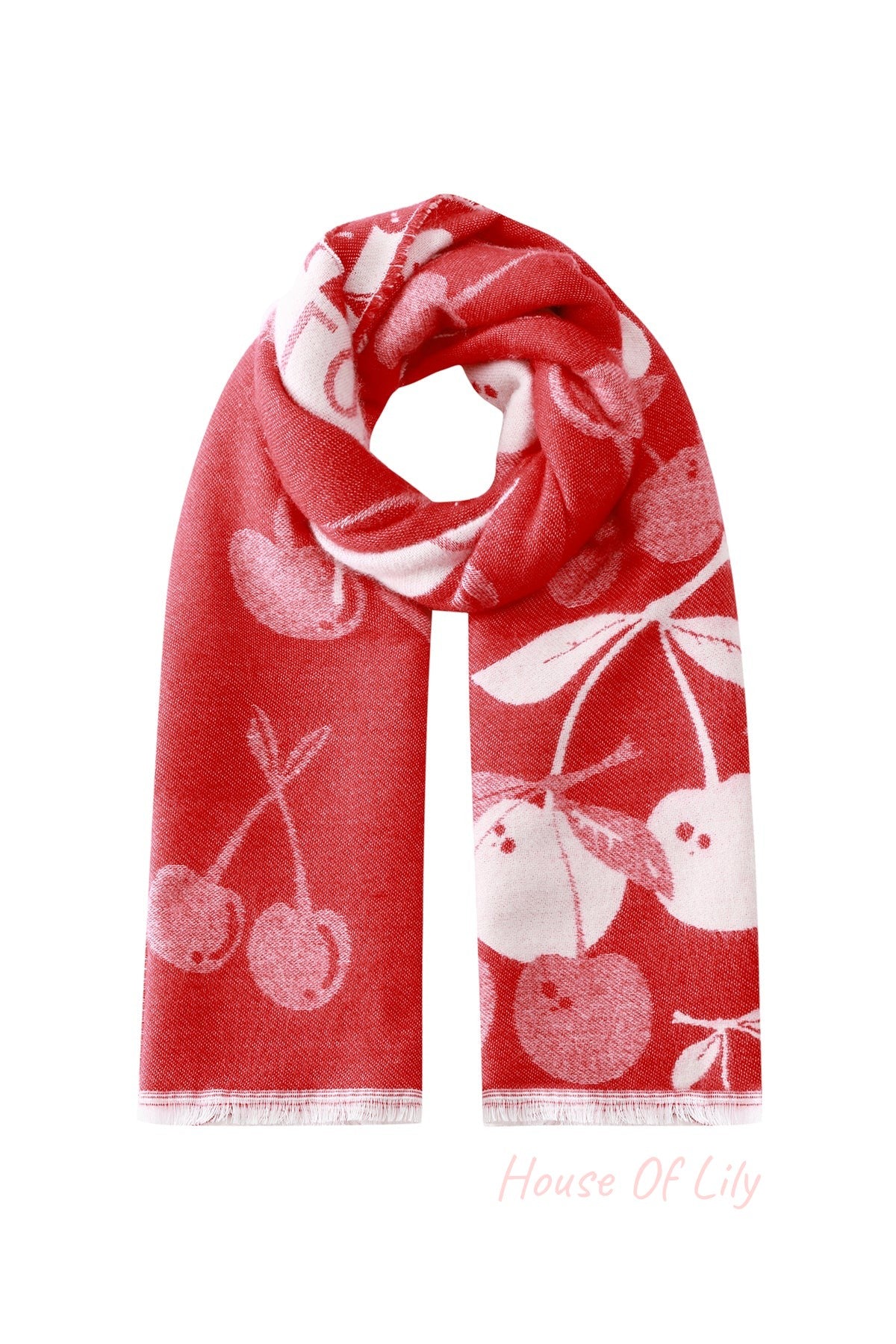 Folded red and white cherry print scarf with fringed edges on white background
