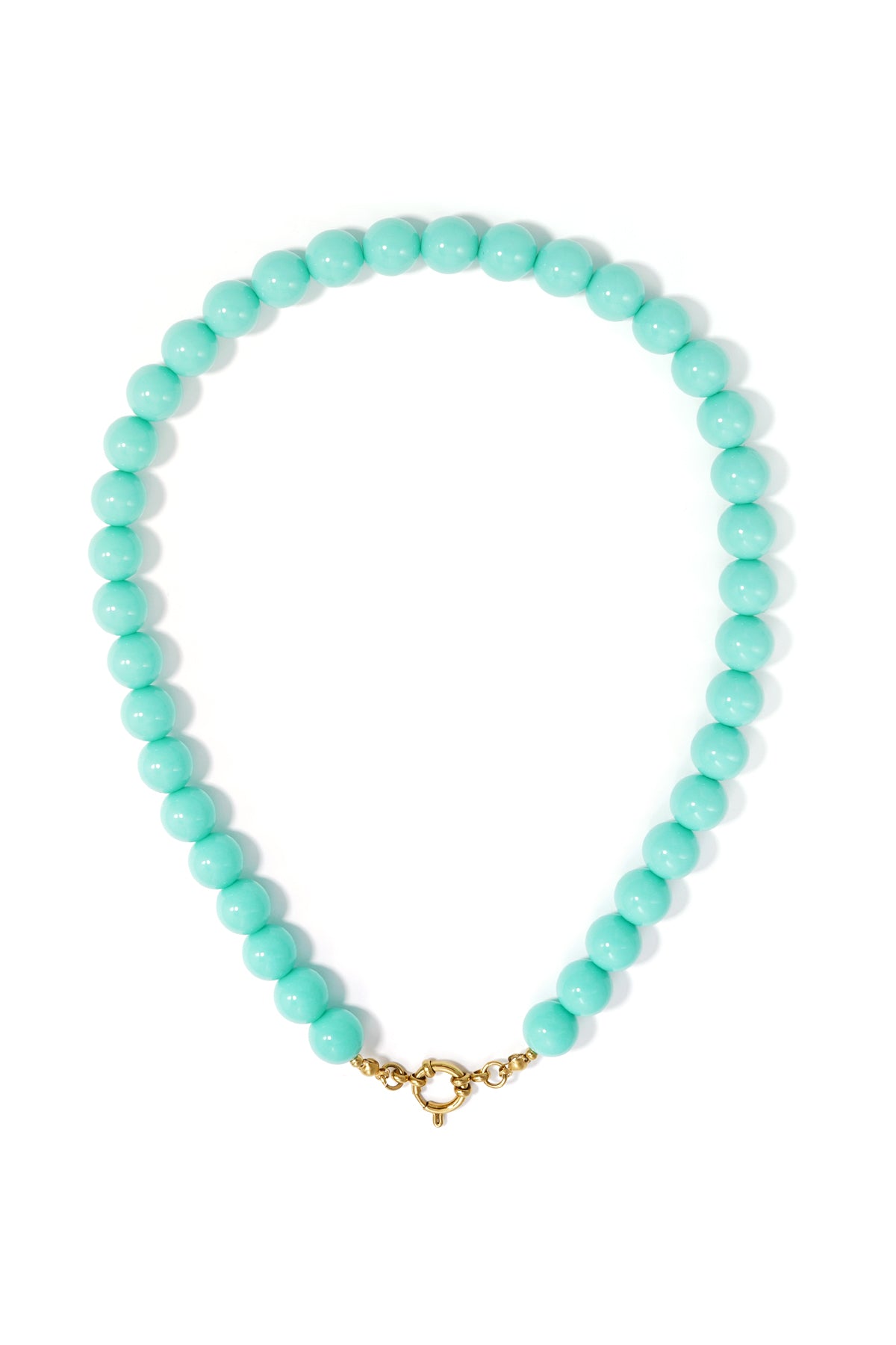 A necklace featuring round, turquoise resin beads finished with a gold-tone circular clasp on a white background.