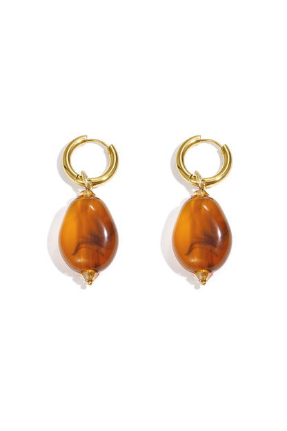 Pair of gold hoop earrings with amber cloudy resin beads