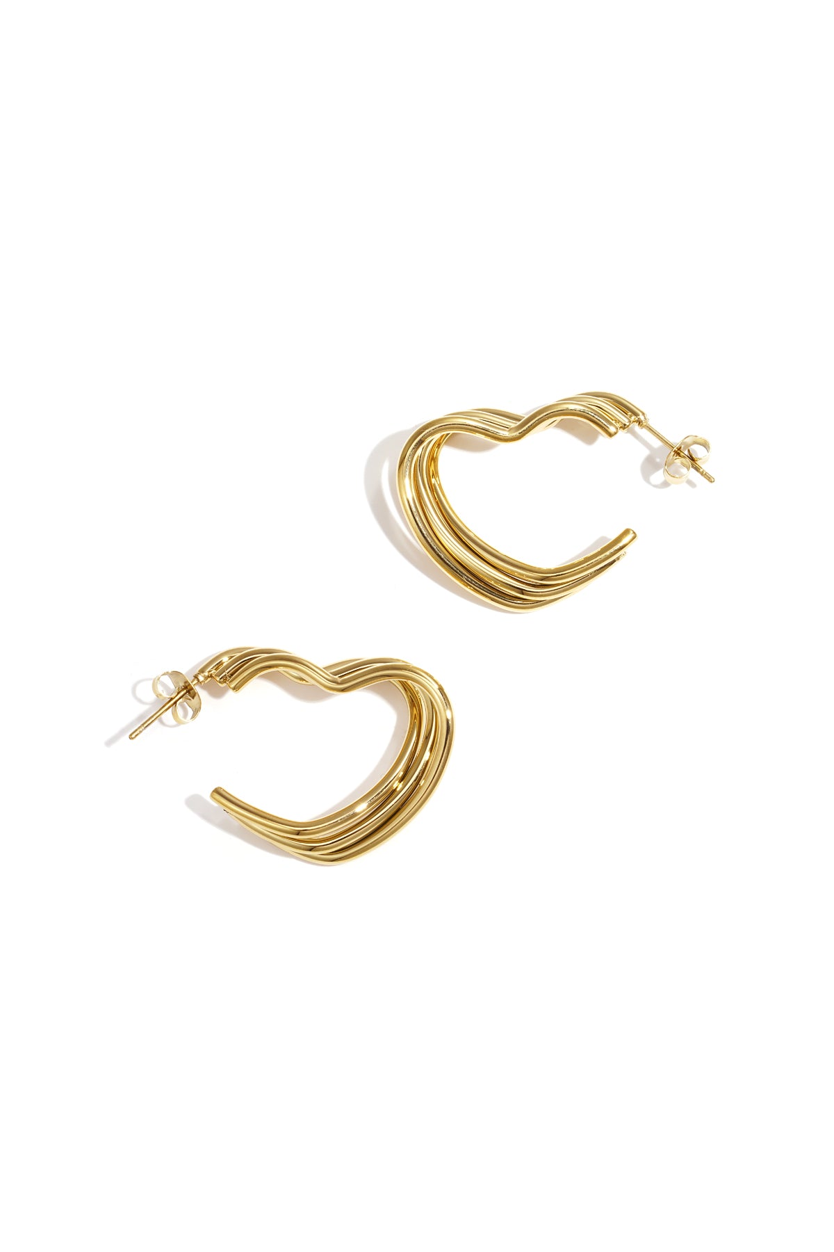 Gold-tone heart-shaped hoop earrings with layered ribbed design on white background
