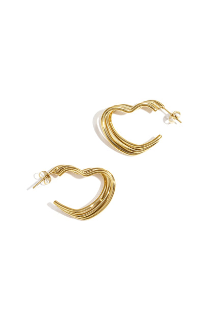 Gold-tone heart-shaped hoop earrings with layered ribbed design on white background