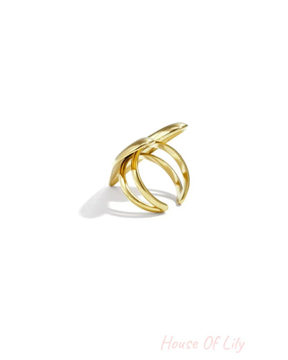 Polished gold multi-band ring with a smooth, organic, leaf-like top design.