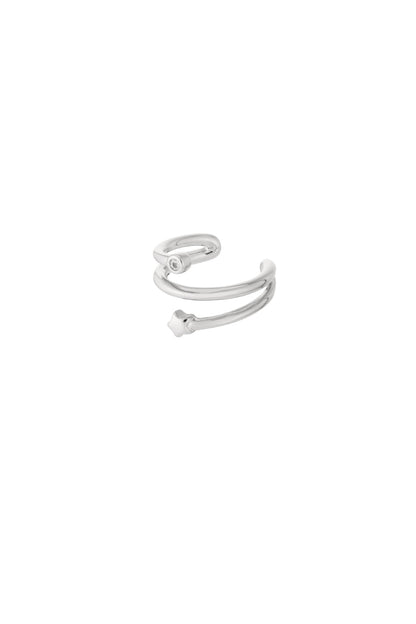 Close-up of silver double spiral ear cuff featuring a small star and rhinestone detail on white background