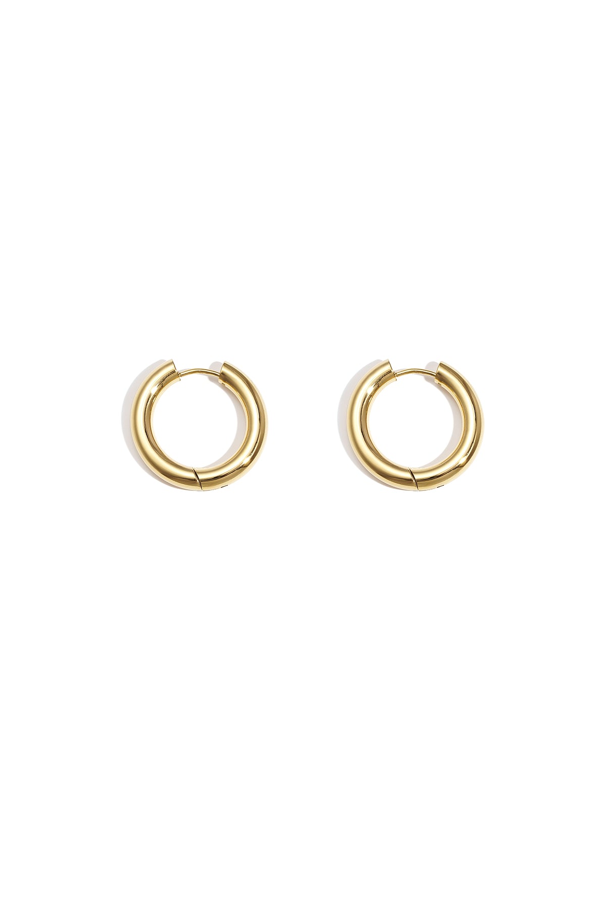 Pair of chunky gold hoop earrings on white background