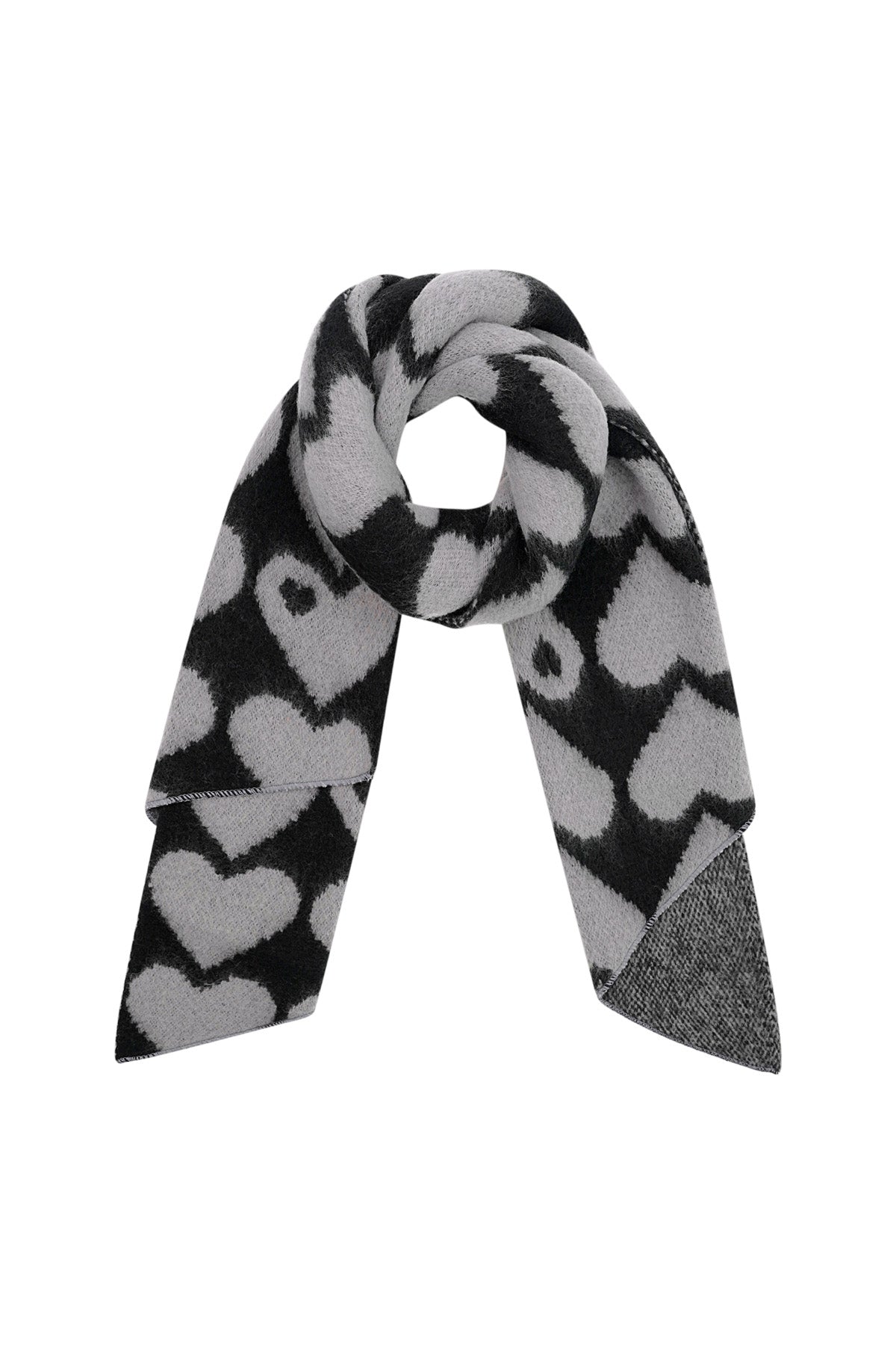Black and gray chunky knit scarf with bold heart design shown looped