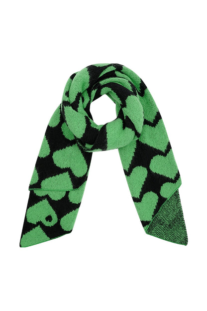 Green and black chunky knit scarf with large heart pattern displayed flat