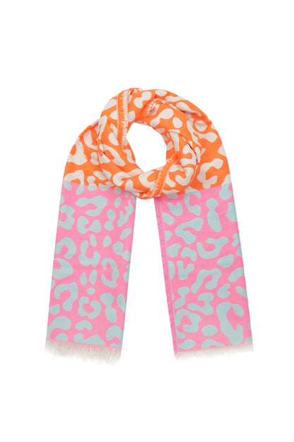 Orange, pink, and mint color block animal print scarf looped with fringed edges on a white background