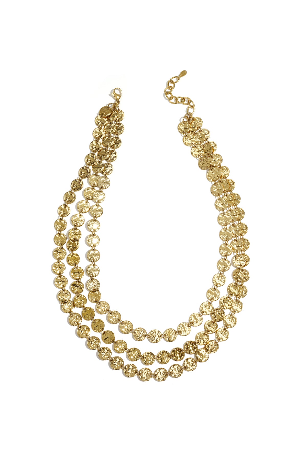 Close-up of a gold-tone triple strand necklace featuring textured hammered coin discs arranged in layers