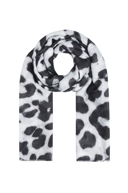 Black and white leopard print scarf laid flat with spool rolled in center